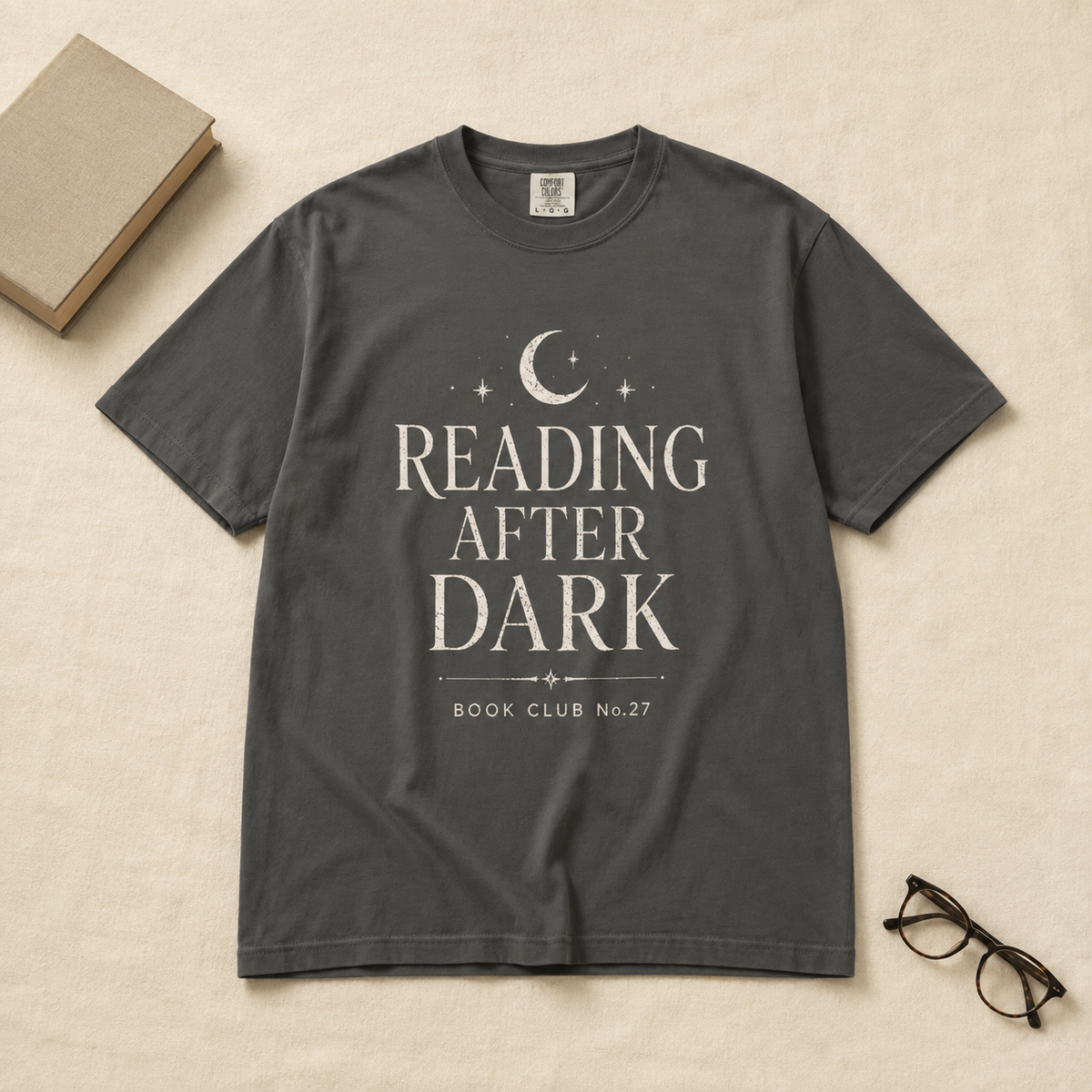 Woman wearing Reading After Dark Book Club T-Shirt in a bookstore